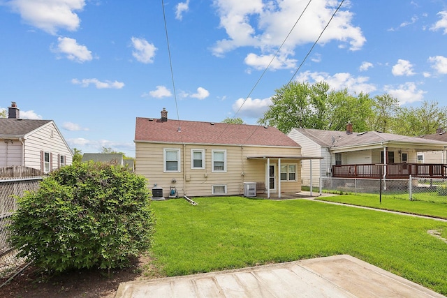 rear view of property with central AC and a patio area
