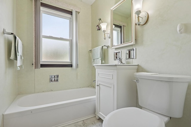 bathroom with toilet, a tub, and vanity