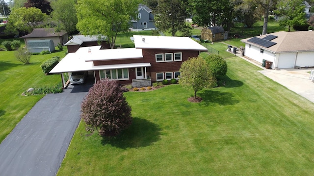 406 E Fine St, Ashkum, IL 60911 - view of front facade featuring asphalt driveway, a front yard, and a residential view