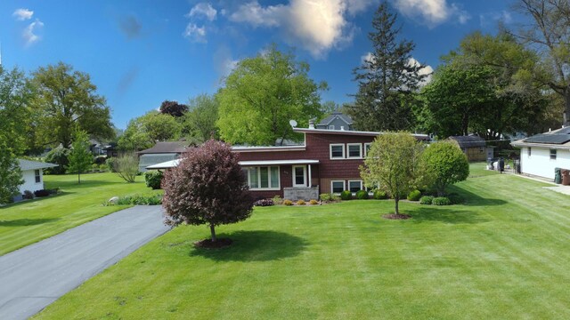 406 E Fine St, Ashkum, IL 60911 - tri-level home featuring a front lawn