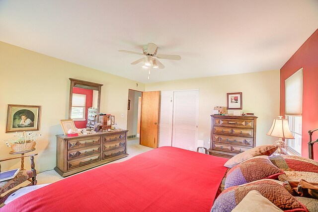 406 E Fine St, Ashkum, IL 60911 - bedroom with light colored carpet, a closet, and ceiling fan