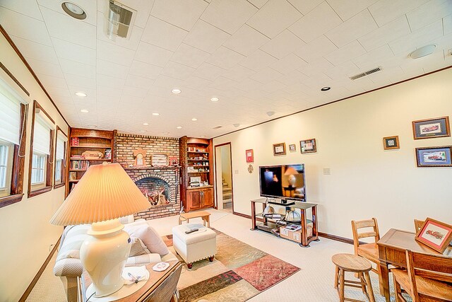 406 E Fine St, Ashkum, IL 60911 - carpeted living area featuring built in shelves, recessed lighting, and baseboards
