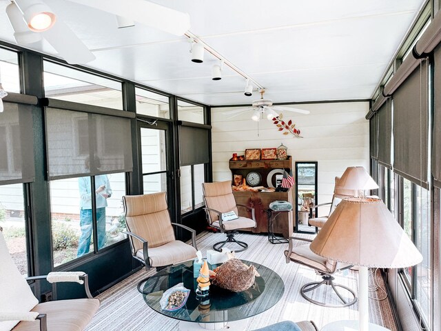 406 E Fine St, Ashkum, IL 60911 - sunroom / solarium with healthy amount of natural light, rail lighting, and a ceiling fan