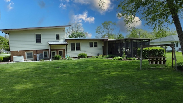 406 E Fine St, Ashkum, IL 60911 - back of house featuring a sunroom and a yard