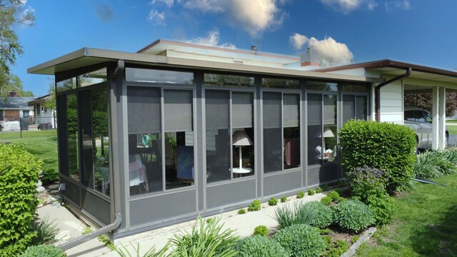 406 E Fine St, Ashkum, IL 60911 - view of property exterior with a sunroom