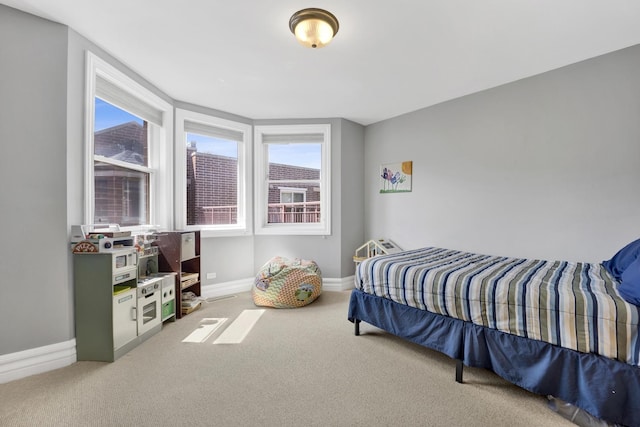 5127 N Damen Ave Unit B, Chicago, IL 60625 - bedroom featuring baseboards, multiple windows, and carpet