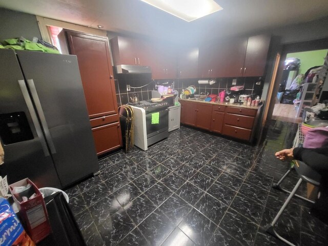 1331 N Campbell Ave, Chicago, IL 60622 - kitchen with stainless steel refrigerator with ice dispenser, stove, under cabinet range hood, and light countertops