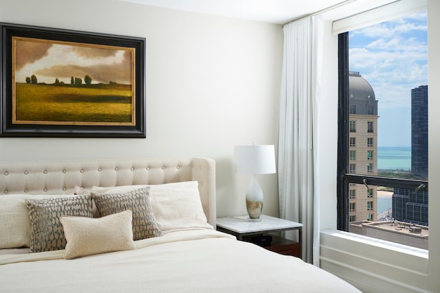 bedroom with multiple windows and expansive windows