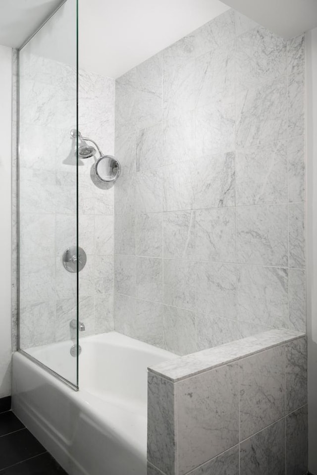 bathroom featuring  shower combination and tile patterned floors