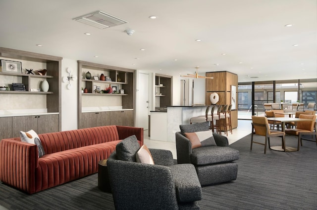 living room featuring recessed lighting and built in features