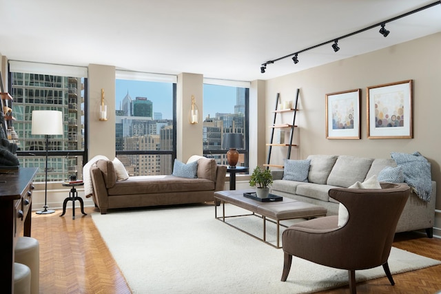 living room with a skyline view and rail lighting
