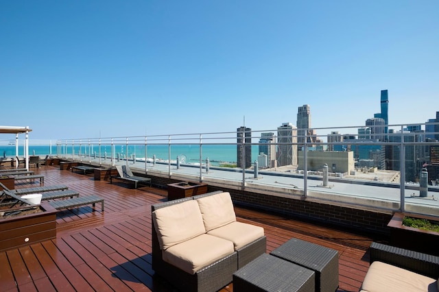 deck featuring a water view and an outdoor hangout area