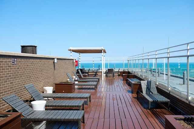 wooden deck with a water view