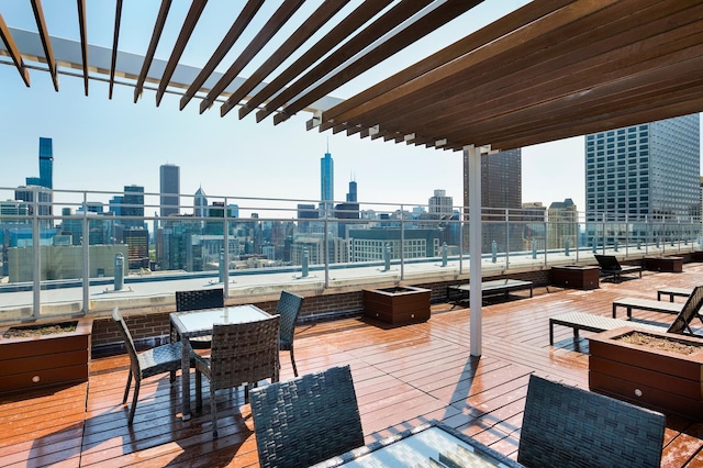wooden deck with a view of skyline