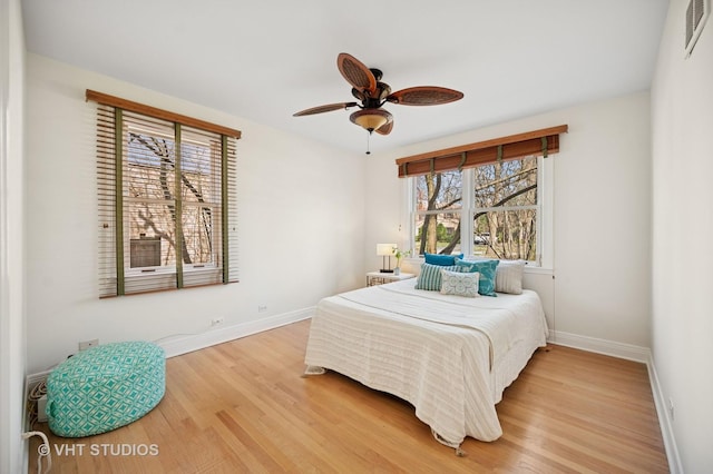 630 Juniper Rd, Glenview, IL 60025 - bedroom with light wood-style floors, baseboards, and ceiling fan