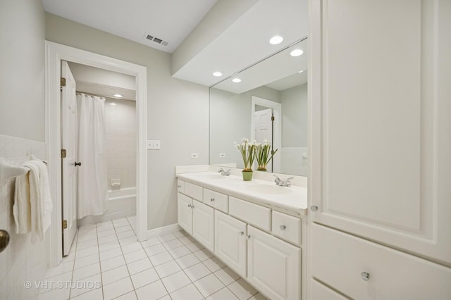 630 Juniper Rd, Glenview, IL 60025 - full bath featuring tile patterned flooring, recessed lighting, double vanity, shower / bath combo, and baseboards