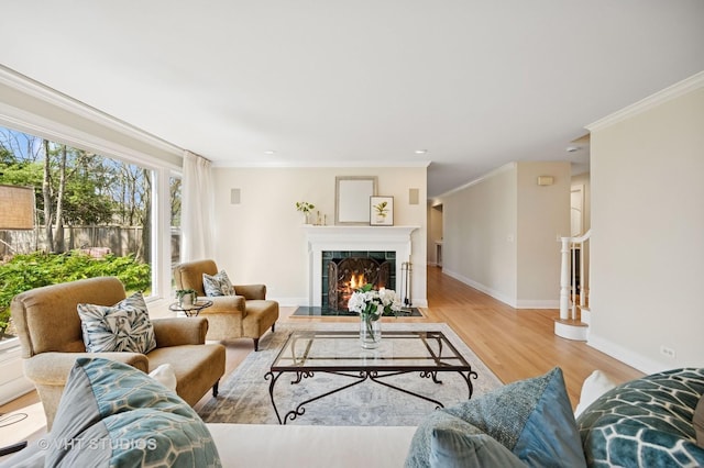 630 Juniper Rd, Glenview, IL 60025 - living room featuring crown molding, light wood-style floors, baseboards, a fireplace with flush hearth, and recessed lighting