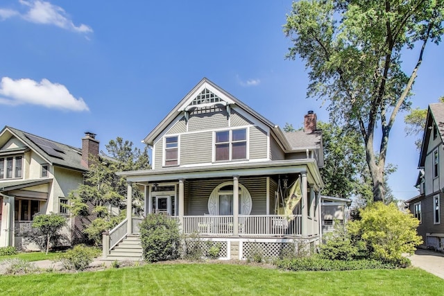 35 Keystone Ave, River Forest, IL 60305 - victorian-style house featuring covered porch, a front lawn, and a chimney