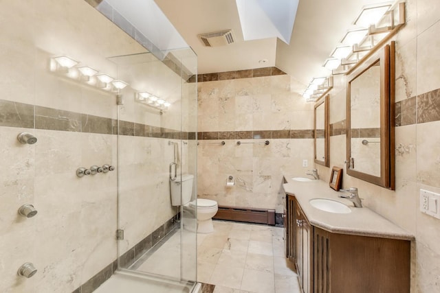 35 Keystone Ave, River Forest, IL 60305 - full bath featuring tile walls, a baseboard radiator, double vanity, a shower stall, and toilet
