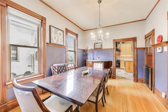 35 Keystone Ave, River Forest, IL 60305 - dining area with a chandelier, light wood-type flooring, beverage cooler, and ornamental molding
