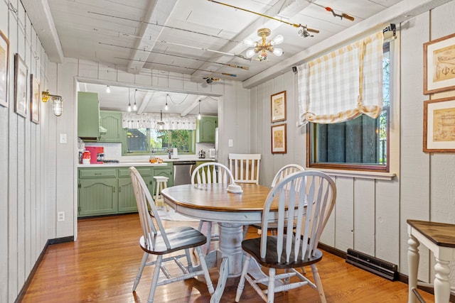 10632 Ventura Blvd, Machesney Park, IL 61115 - dining room with light wood finished floors and baseboards