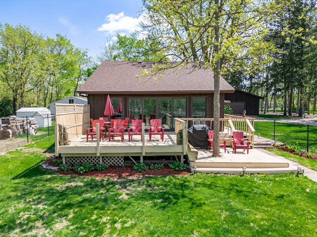 10632 Ventura Blvd, Machesney Park, IL 61115 - back of property featuring a wooden deck and roof with shingles