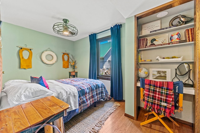 10632 Ventura Blvd, Machesney Park, IL 61115 - bedroom with wood finished floors and baseboards