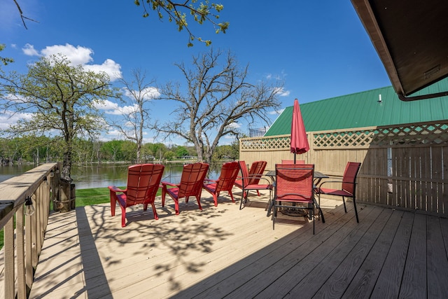 10632 Ventura Blvd, Machesney Park, IL 61115 - wooden deck with a water view and outdoor dining area