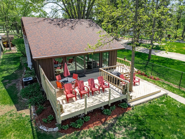 10632 Ventura Blvd, Machesney Park, IL 61115 - deck with central AC unit and a yard