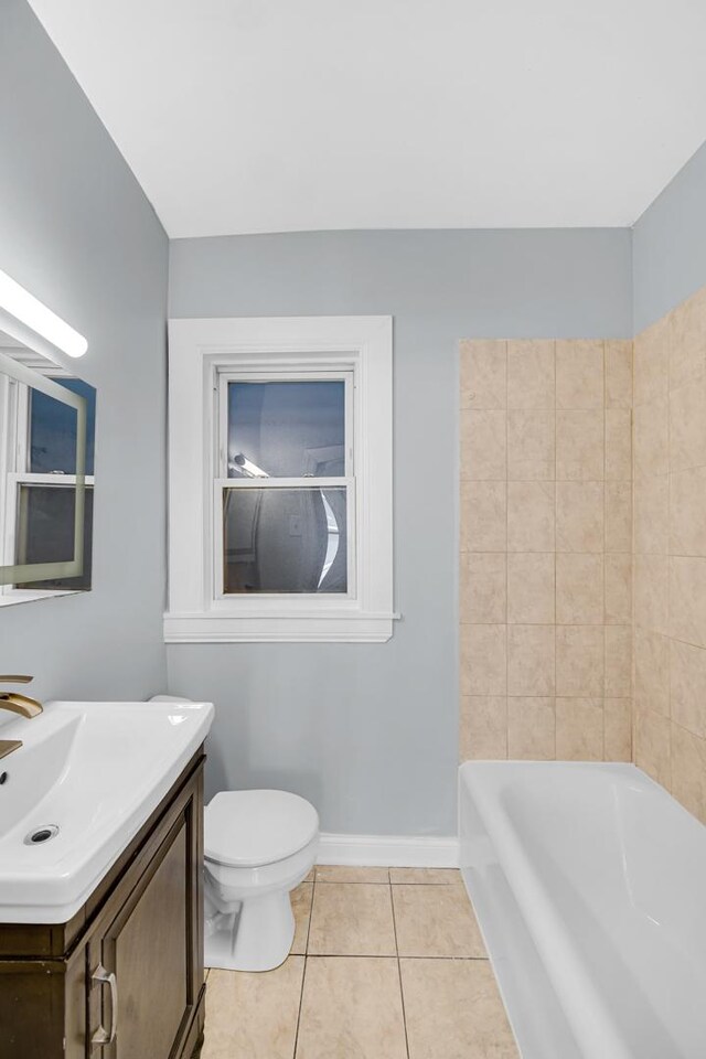 7316 S Woodlawn Ave, Chicago, IL 60619 - bathroom with tile patterned flooring, vanity, toilet, and baseboards