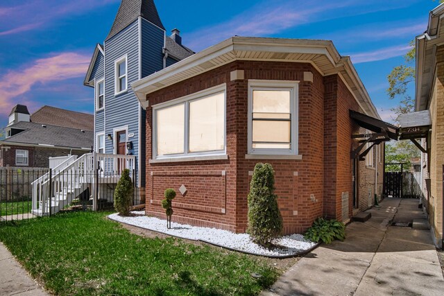 7316 S Woodlawn Ave, Chicago, IL 60619 - property exterior at dusk with brick siding