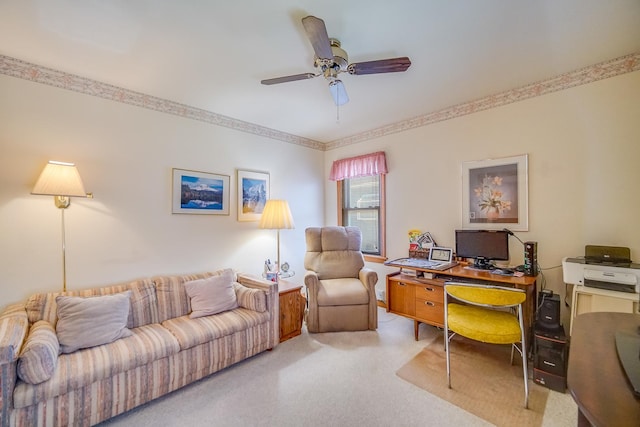 carpeted home office featuring a ceiling fan