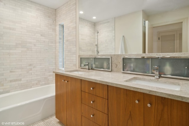 bathroom with a tub, double vanity, and a shower