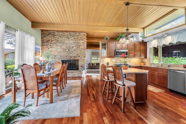 347 Park Dr, Palatine, IL 60067 - kitchen featuring stainless steel appliances, a sink, a kitchen island, a chandelier, and wood ceiling