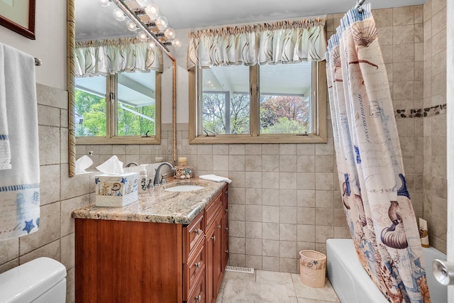 347 Park Dr, Palatine, IL 60067 - bathroom with tile walls, vanity, shower / bath combination with curtain, toilet, and tile patterned flooring