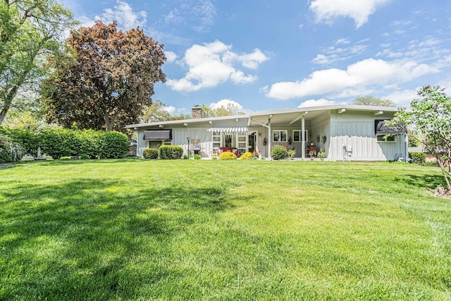 347 Park Dr, Palatine, IL 60067 - rear view of property with a chimney and a lawn
