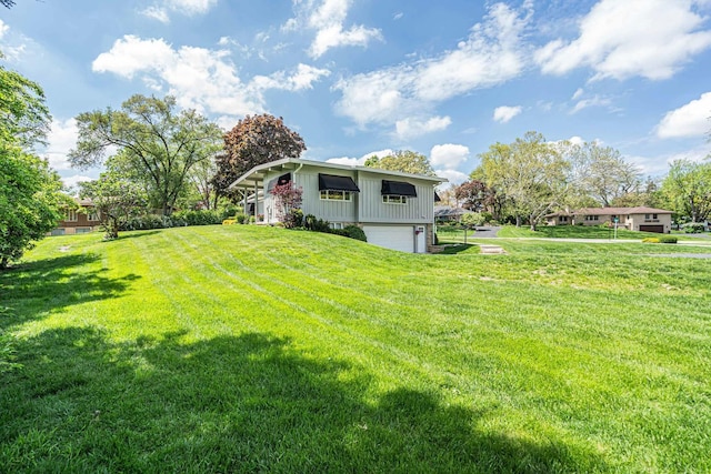 347 Park Dr, Palatine, IL 60067 - view of grassy yard with an attached garage
