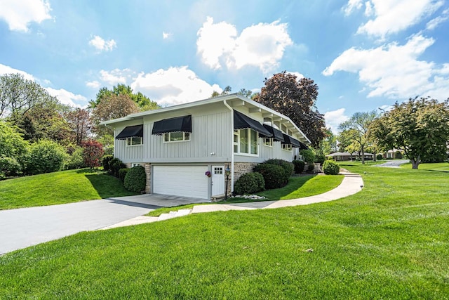 347 Park Dr, Palatine, IL 60067 - view of home's exterior with an attached garage, driveway, a yard, and board and batten siding