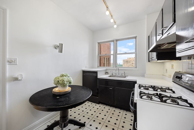 5000 S Cornell Ave Unit 21B, Chicago, IL 60615 - kitchen with range with gas cooktop, a sink, dishwasher, dark cabinetry, and under cabinet range hood