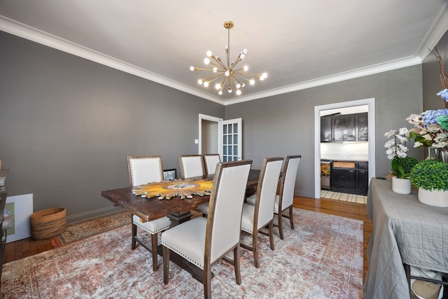 5000 S Cornell Ave Unit 21B, Chicago, IL 60615 - dining room with a chandelier, light wood finished floors, crown molding, and baseboards