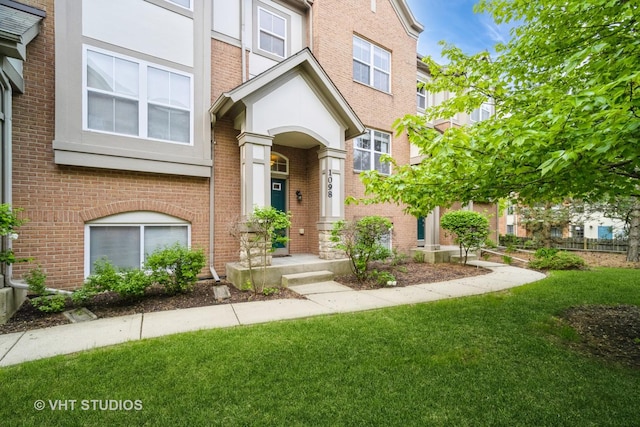 1098 N Claremont Dr Unit 1, Palatine, IL 60074 - multi unit property with a front yard and brick siding