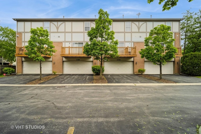 1098 N Claremont Dr Unit 1, Palatine, IL 60074 - view of property featuring an attached garage and driveway