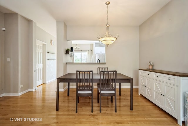 1098 N Claremont Dr Unit 1, Palatine, IL 60074 - dining area with light wood-type flooring, baseboards, and a chandelier