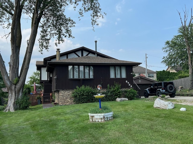 8734 W 99th St, Palos Hills, IL 60465 - back of house featuring brick siding, board and batten siding, and a shingled roof