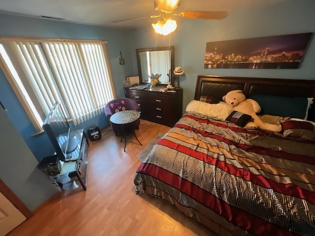8734 W 99th St, Palos Hills, IL 60465 - bedroom with wood finished floors and a ceiling fan