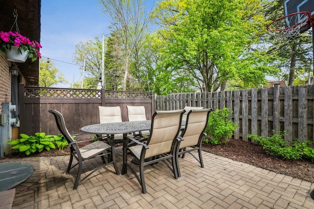 1063 W Busse Hwy, Park Ridge, IL 60068 - view of patio featuring outdoor dining area and a fenced backyard