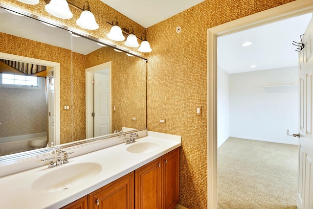 bathroom with toilet and double vanity