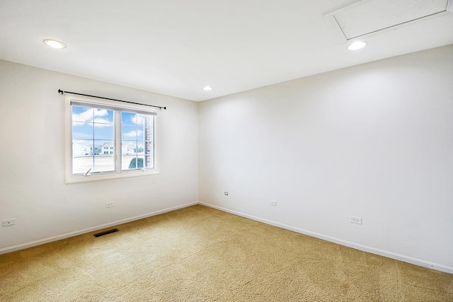 carpeted spare room with baseboards and recessed lighting