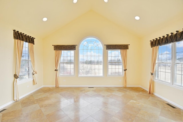 unfurnished room with high vaulted ceiling, baseboards, and recessed lighting