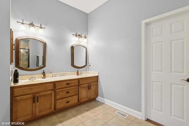 25738 W Sunnymere Dr, Plainfield, IL 60585 - full bath featuring double vanity, tile patterned floors, baseboards, and a shower with shower door